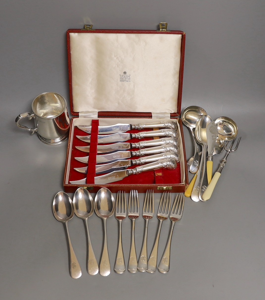 A cased set Garrard pistol handled steak knives, other plated cutlery and a plated mug